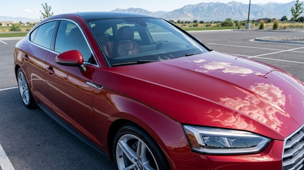 A red sedan with stain resistant paint protection film in Salt Lake City